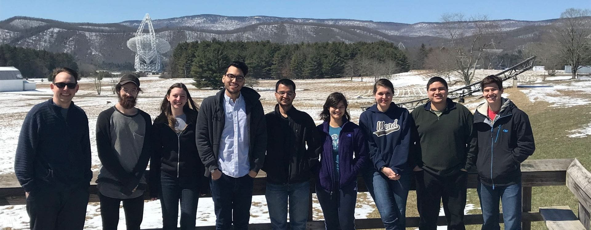 The 2018 graduate SETI course students stand in front of the Green Bank Telescope.